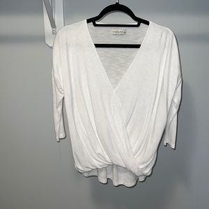 3/4 length sleeve white shirt with fun wrap around front detailing